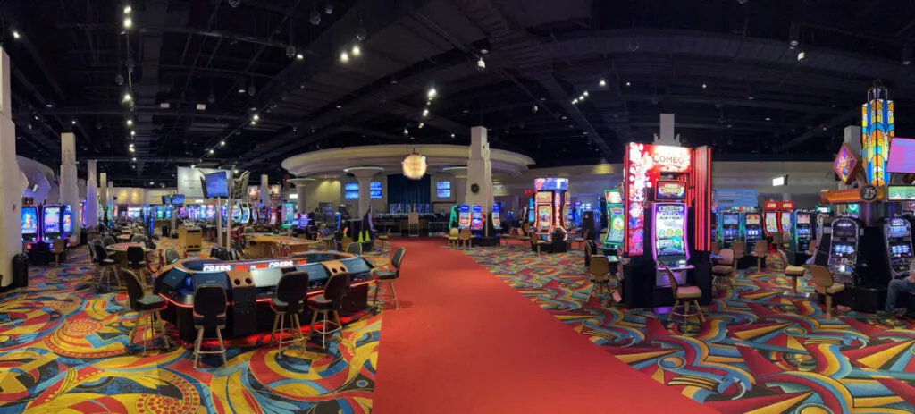 Inside Hollywood Casino Bangor showing rows of slots and gaming tables