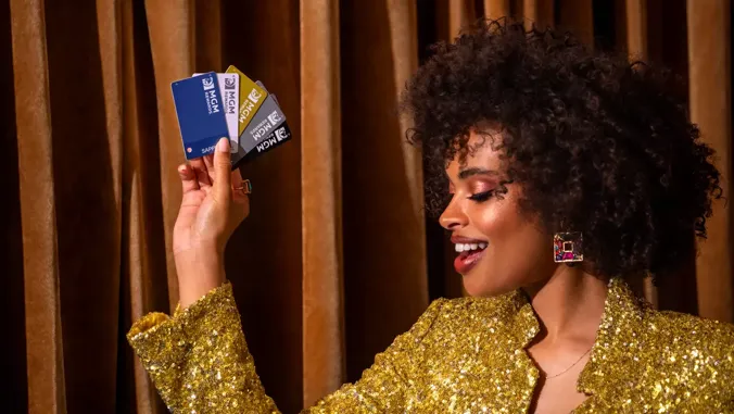 Guest holding MGM Rewards cards at MGM National Harbor in Oxon Hill, MD