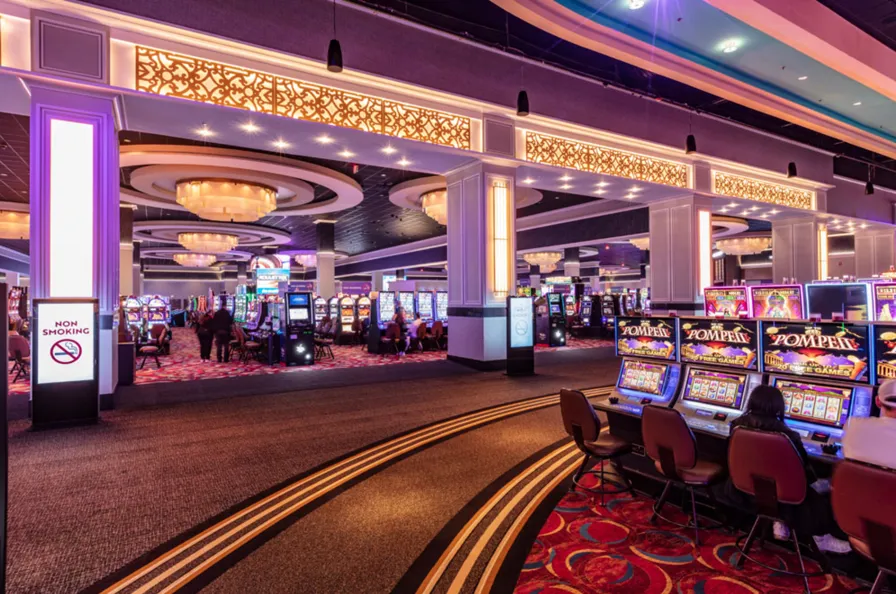 Casino floor at WinStar World Casino &amp; Resort with rows of slot machines shown